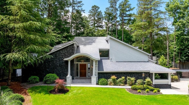 4070 Whitewater Creek Rd, Atlanta, GA 30327 - view of front of home featuring stone siding, a front yard, and view of scattered trees