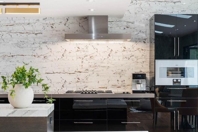 4070 Whitewater Creek Rd, Atlanta, GA 30327 - kitchen featuring wall chimney range hood, white microwave, and stainless steel gas cooktop