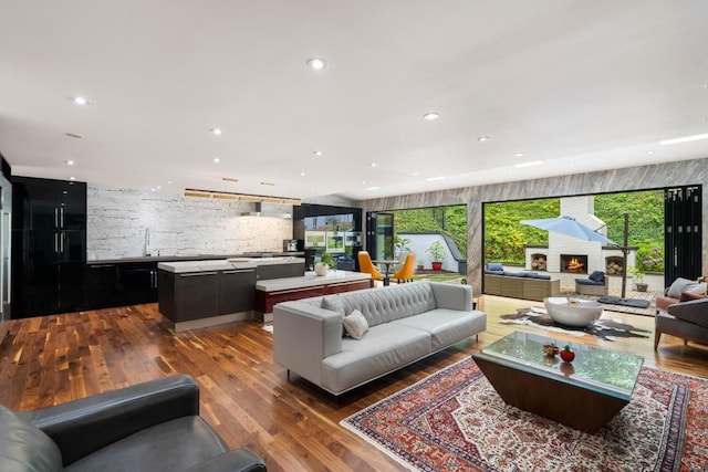 4070 Whitewater Creek Rd, Atlanta, GA 30327 - living area with dark wood-type flooring, recessed lighting, and a lit fireplace