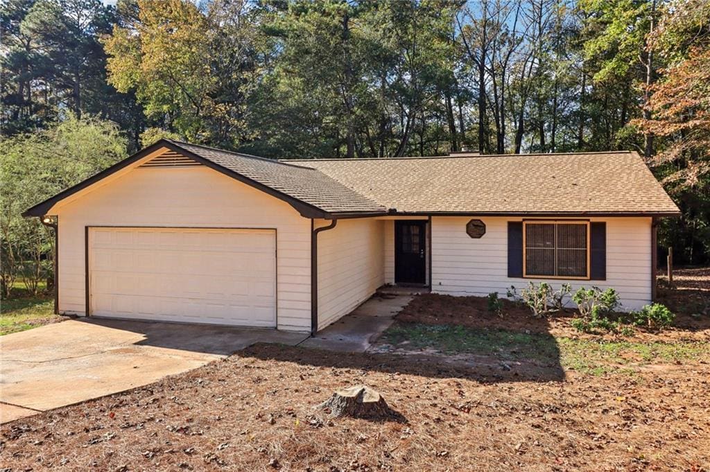 single story home featuring a garage