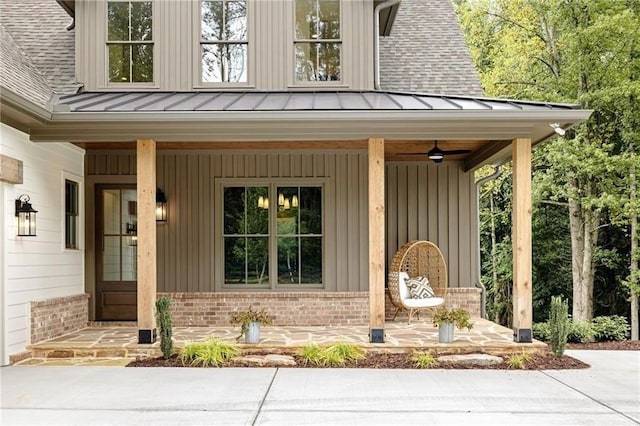 view of exterior entry with covered porch