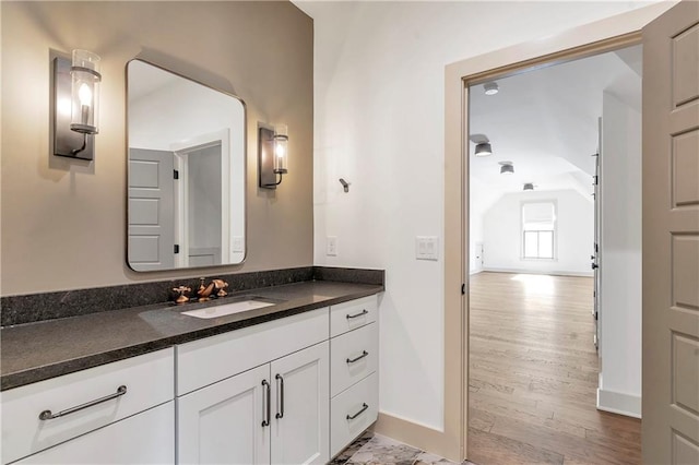 bathroom featuring vanity and wood-type flooring