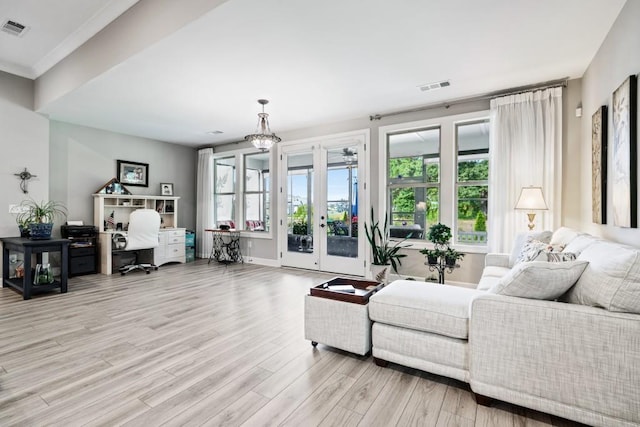 310 Chatuge Dr, Hoschton, GA 30548 - living area featuring light wood-type flooring, french doors, an office area, and baseboards
