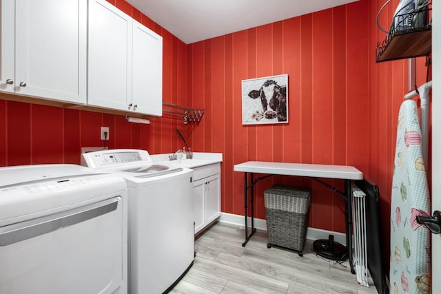 310 Chatuge Dr, Hoschton, GA 30548 - laundry room featuring cabinet space, separate washer and dryer, and light wood-style flooring