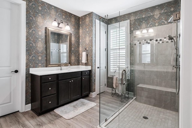310 Chatuge Dr, Hoschton, GA 30548 - full bathroom featuring a stall shower, vanity, baseboards, and wood finished floors