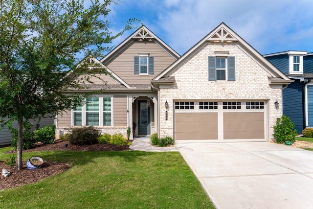 310 Chatuge Dr, Hoschton, GA 30548 - craftsman inspired home featuring concrete driveway, a front lawn, and brick siding