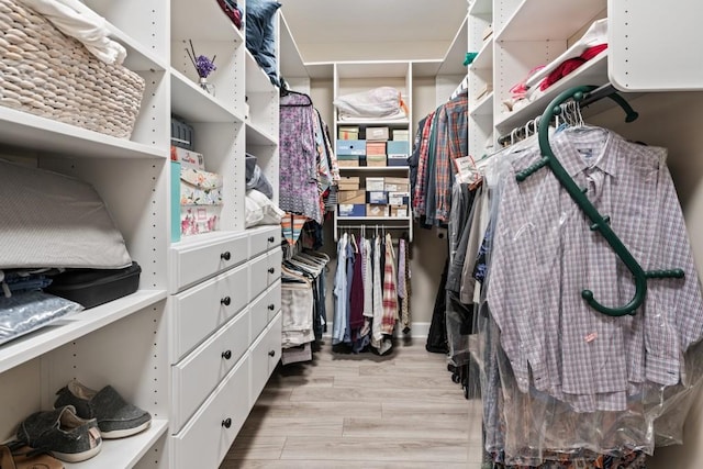 310 Chatuge Dr, Hoschton, GA 30548 - walk in closet with wood finished floors