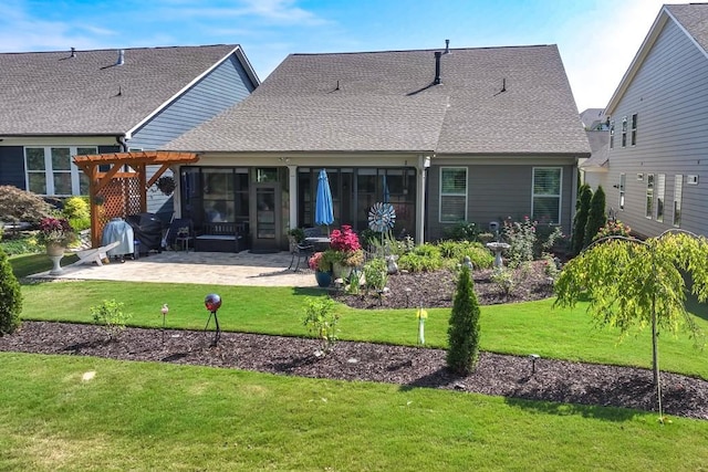 310 Chatuge Dr, Hoschton, GA 30548 - back of house featuring a pergola, a patio area, a yard, and a shingled roof