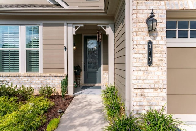 310 Chatuge Dr, Hoschton, GA 30548 - property entrance featuring brick siding