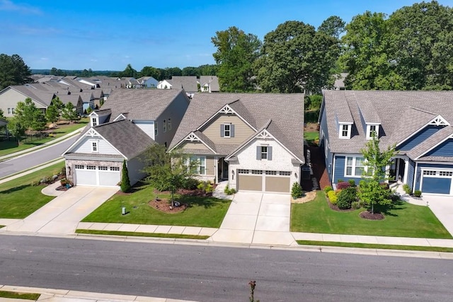 310 Chatuge Dr, Hoschton, GA 30548 - craftsman inspired home with concrete driveway, a garage, a residential view, and a front yard