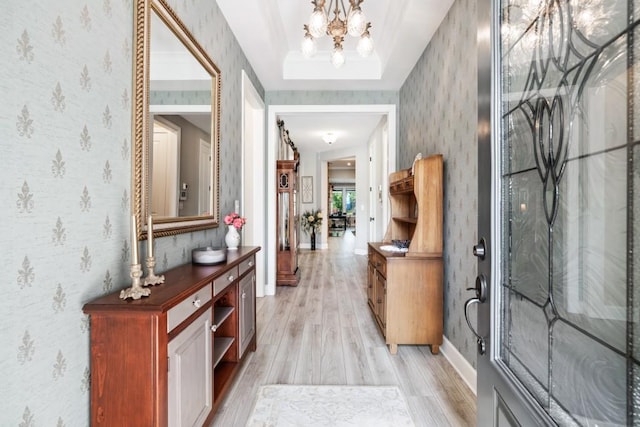 310 Chatuge Dr, Hoschton, GA 30548 - entrance foyer with light wood-type flooring, a chandelier, wallpapered walls, and baseboards