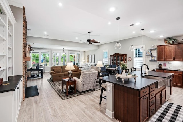 310 Chatuge Dr, Hoschton, GA 30548 - kitchen featuring dark countertops, a sink, ceiling fan, light wood finished floors, and recessed lighting