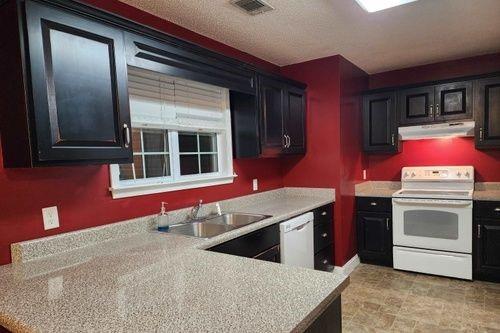 kitchen with white appliances and sink