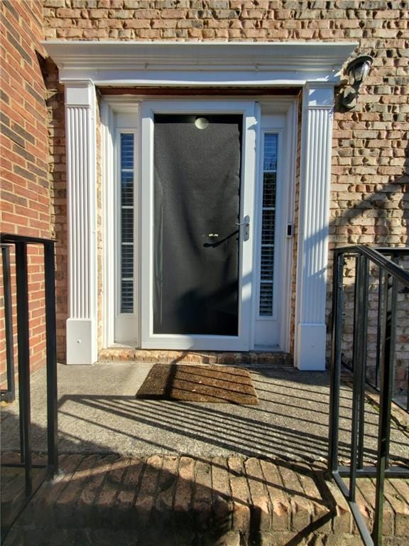 4215 Wildener Way, Cumming, GA 30041 - property entrance featuring brick siding and roof with shingles