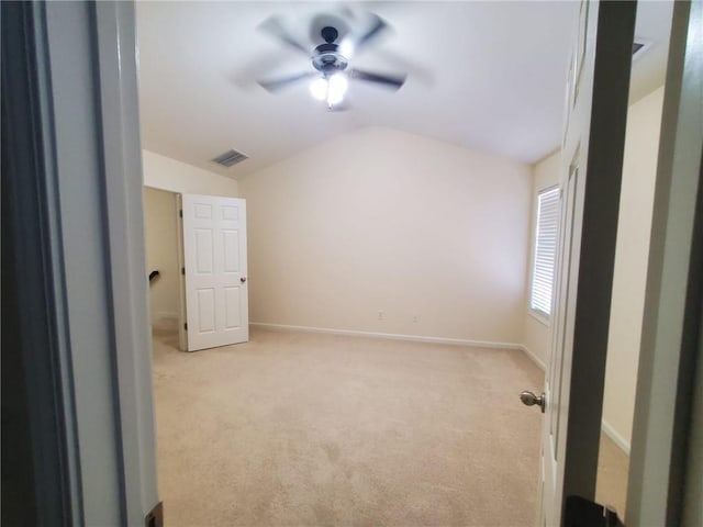 4215 Wildener Way, Cumming, GA 30041 - unfurnished bedroom with visible vents, a ceiling fan, baseboards, lofted ceiling, and light colored carpet