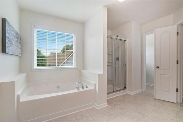 bathroom featuring shower with separate bathtub and tile patterned floors