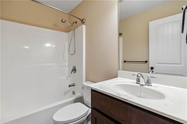 full bath featuring vanity, toilet, and shower / tub combination