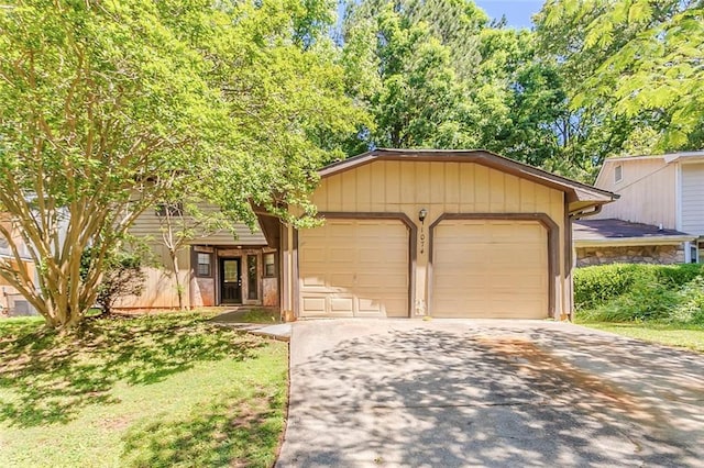 view of front of home featuring driveway and a garage