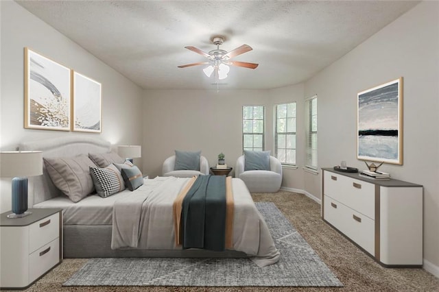 carpeted bedroom with baseboards and a ceiling fan