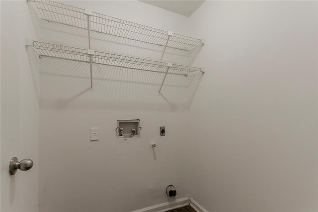 laundry area featuring hookup for an electric dryer, hookup for a washing machine, baseboards, and hookup for a gas dryer