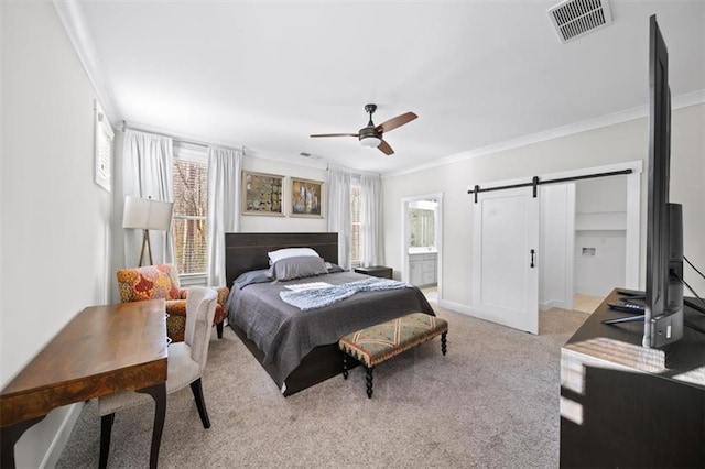 bedroom with visible vents, ceiling fan, carpet, a barn door, and ornamental molding