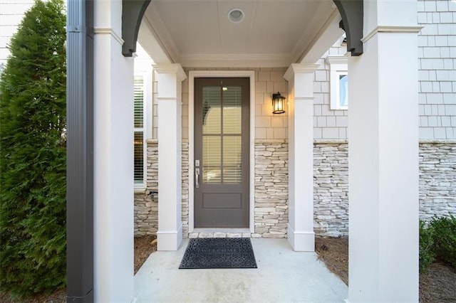 entrance to property featuring stone siding