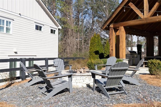 view of patio / terrace with an outdoor fire pit