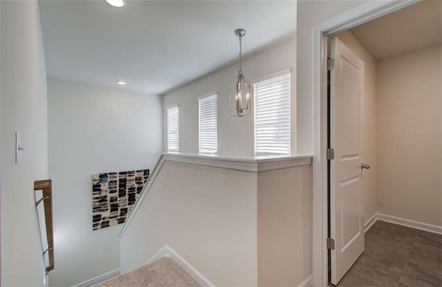 corridor with recessed lighting and baseboards