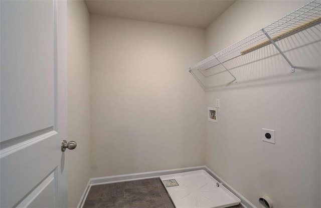 laundry room featuring hookup for an electric dryer, laundry area, baseboards, and hookup for a washing machine