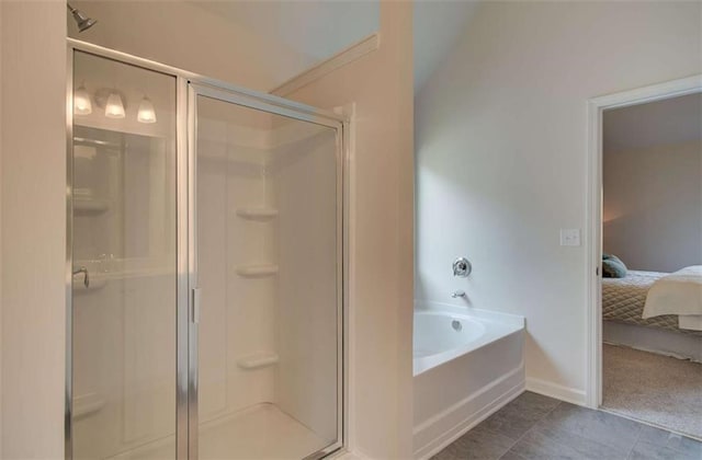 full bath featuring a bath, a stall shower, tile patterned floors, and connected bathroom