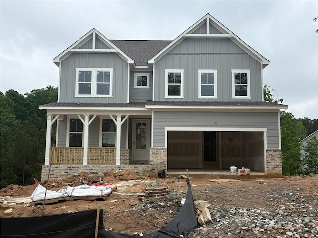 373 Riverwood Pass, Dallas, GA 30157 - view of front of house featuring a porch, brick siding, board and batten siding, and an attached garage