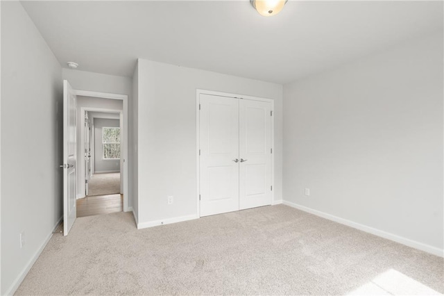 373 Riverwood Pass, Dallas, GA 30157 - unfurnished bedroom with light carpet, a closet, and baseboards