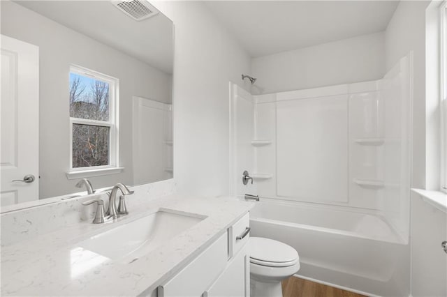 373 Riverwood Pass, Dallas, GA 30157 - bathroom with toilet, vanity, wood finished floors, and bathtub / shower combination