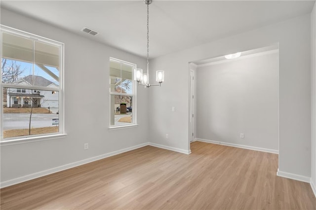 373 Riverwood Pass, Dallas, GA 30157 - unfurnished dining area featuring light wood finished floors, a chandelier, and baseboards