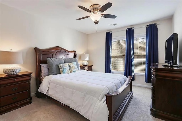 bedroom with visible vents, a ceiling fan, baseboards, and carpet floors