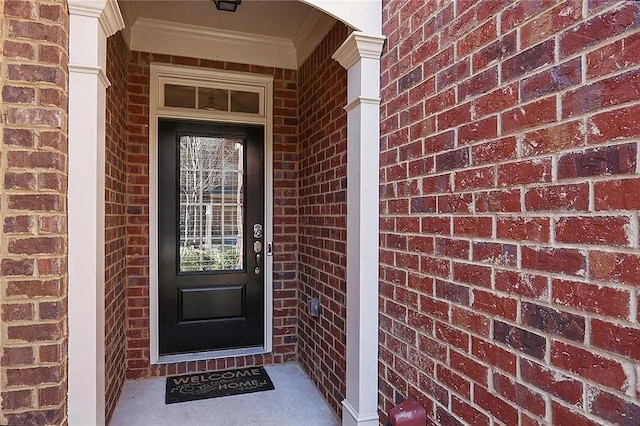 entrance to property with brick siding