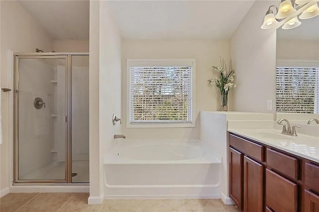 full bath featuring tile patterned floors, vanity, a bath, and a shower stall