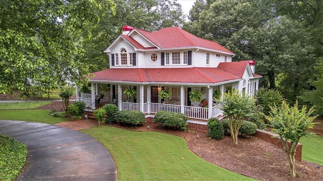 416 Mcdaniel St, Monroe, GA 30655 - country-style home featuring a front yard and a porch