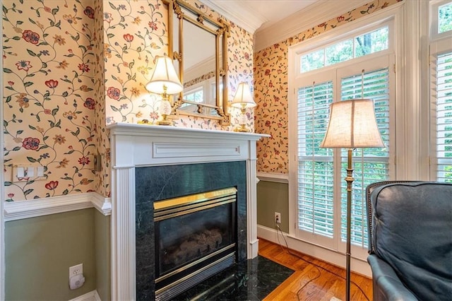 416 Mcdaniel St, Monroe, GA 30655 - detailed view of wallpapered walls, crown molding, a high end fireplace, wood finished floors, and baseboards