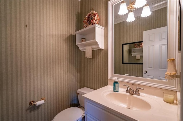 416 Mcdaniel St, Monroe, GA 30655 - bathroom featuring wallpapered walls, toilet, and vanity