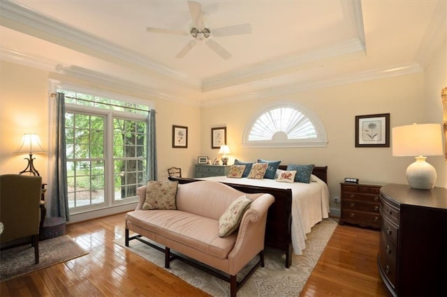 416 Mcdaniel St, Monroe, GA 30655 - bedroom with hardwood / wood-style floors, a raised ceiling, ornamental molding, and a ceiling fan