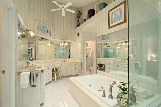 416 Mcdaniel St, Monroe, GA 30655 - bathroom featuring wallpapered walls, a tub with jets, ceiling fan, toilet, and a shower stall