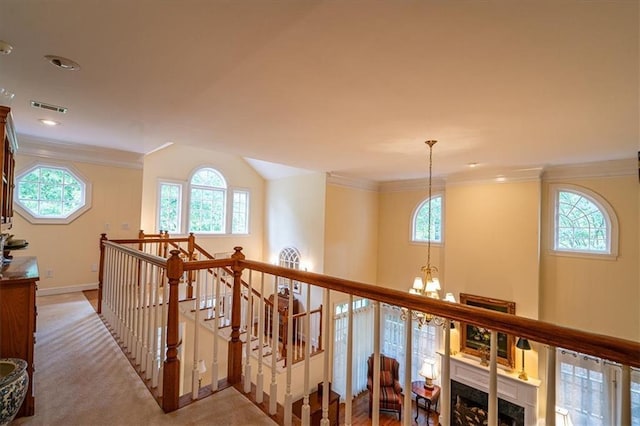 416 Mcdaniel St, Monroe, GA 30655 - hall featuring healthy amount of natural light, an upstairs landing, crown molding, a chandelier, and recessed lighting