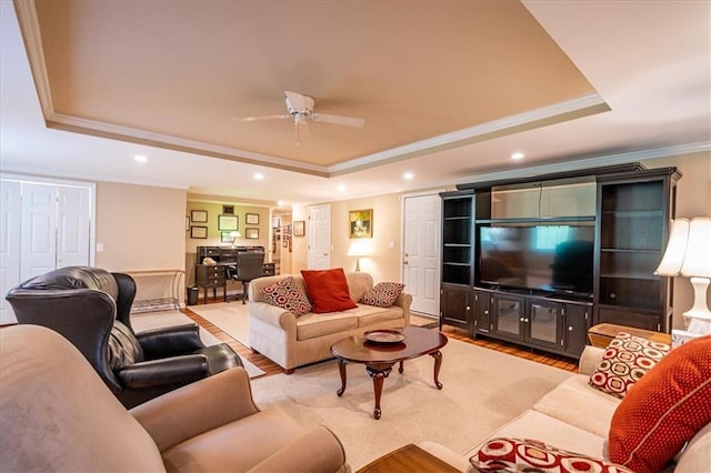 416 Mcdaniel St, Monroe, GA 30655 - living room featuring a tray ceiling, crown molding, wood finished floors, ceiling fan, and recessed lighting