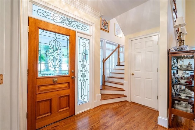 416 Mcdaniel St, Monroe, GA 30655 - foyer entrance featuring wood finished floors, stairs, lofted ceiling, and baseboards