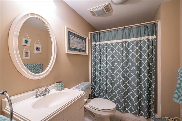 416 Mcdaniel St, Monroe, GA 30655 - full bath featuring vanity, toilet, tile patterned floors, and curtained shower