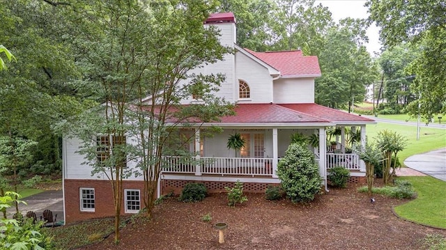 416 Mcdaniel St, Monroe, GA 30655 - farmhouse-style home with covered porch, a chimney, and roof with shingles
