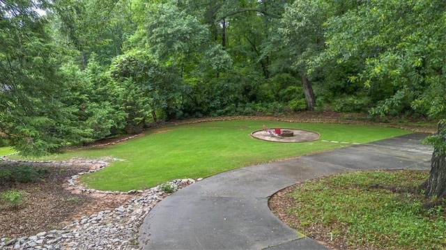 416 Mcdaniel St, Monroe, GA 30655 - view of grassy yard featuring a fire pit