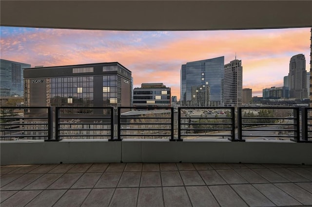 balcony at dusk with a view of skyline