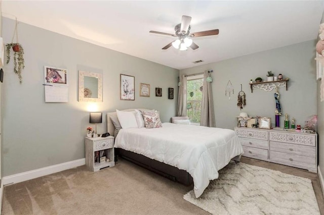 bedroom featuring ceiling fan and carpet